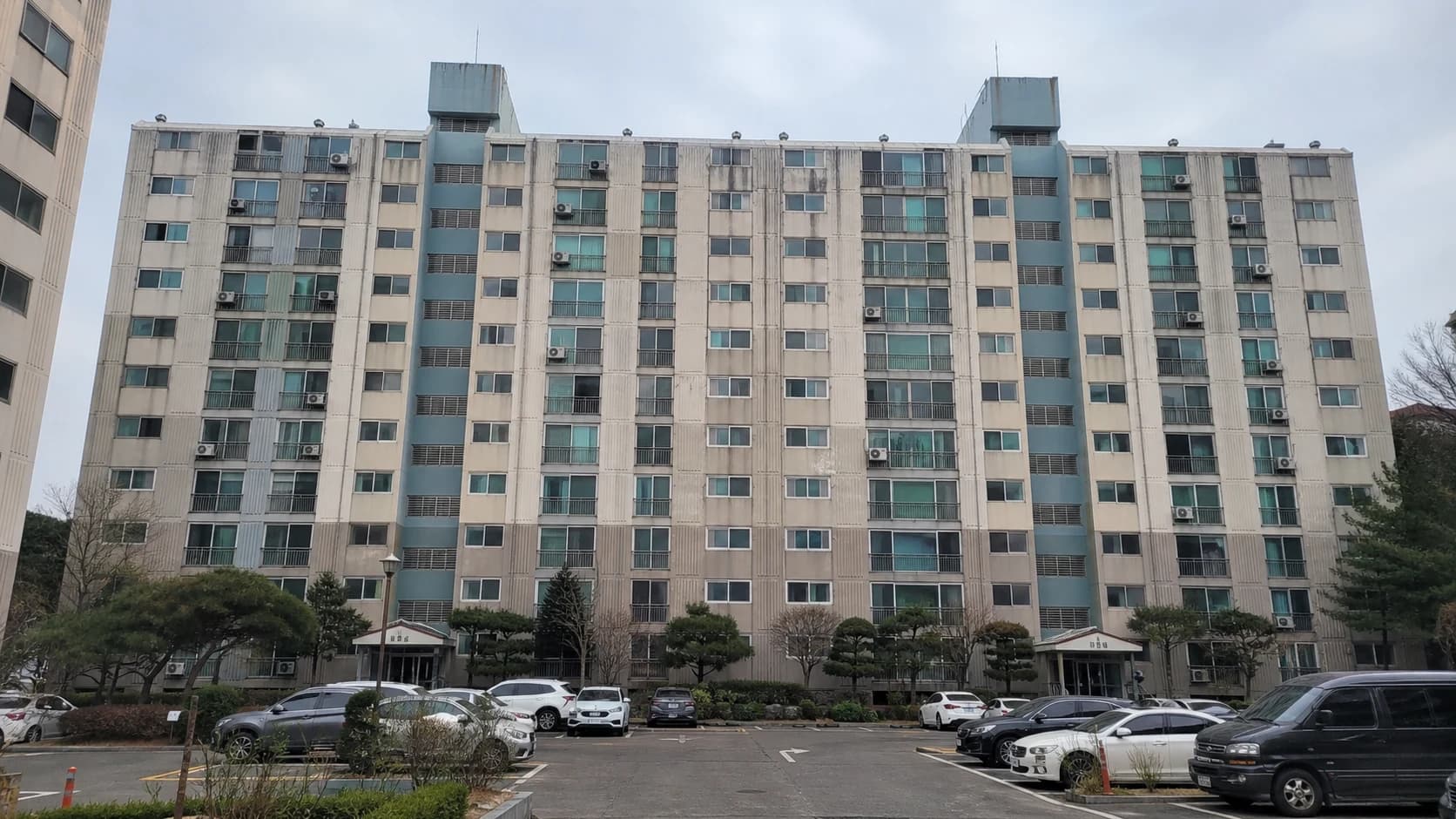 Original apartment exterior before repainting